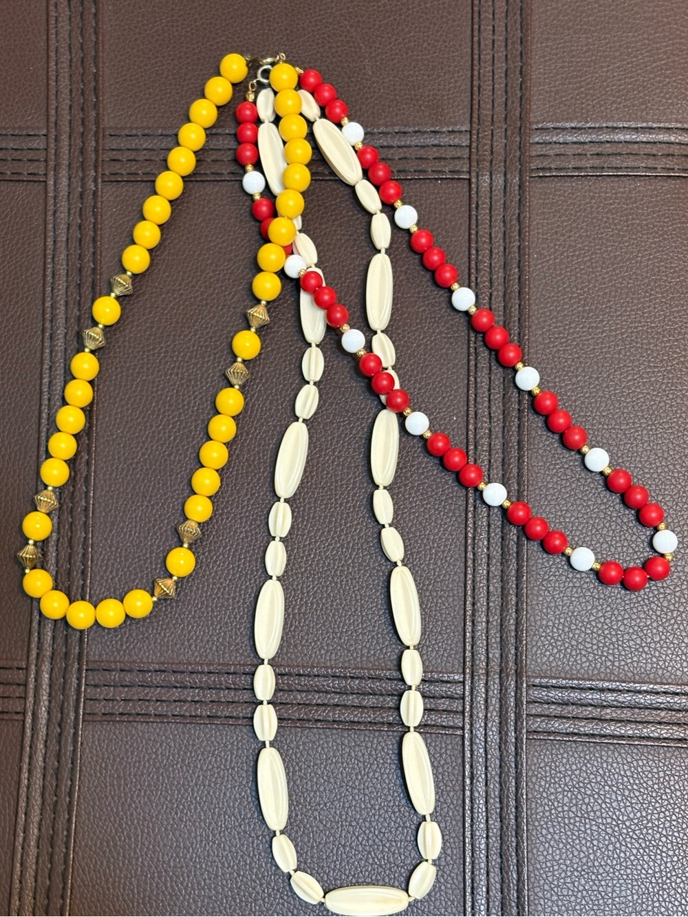 3 Beaded Necklaces Are Yellow/Gold, & Red/White/Gold, & Cream